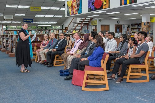 educator giving a talk to iskl teachers and parents