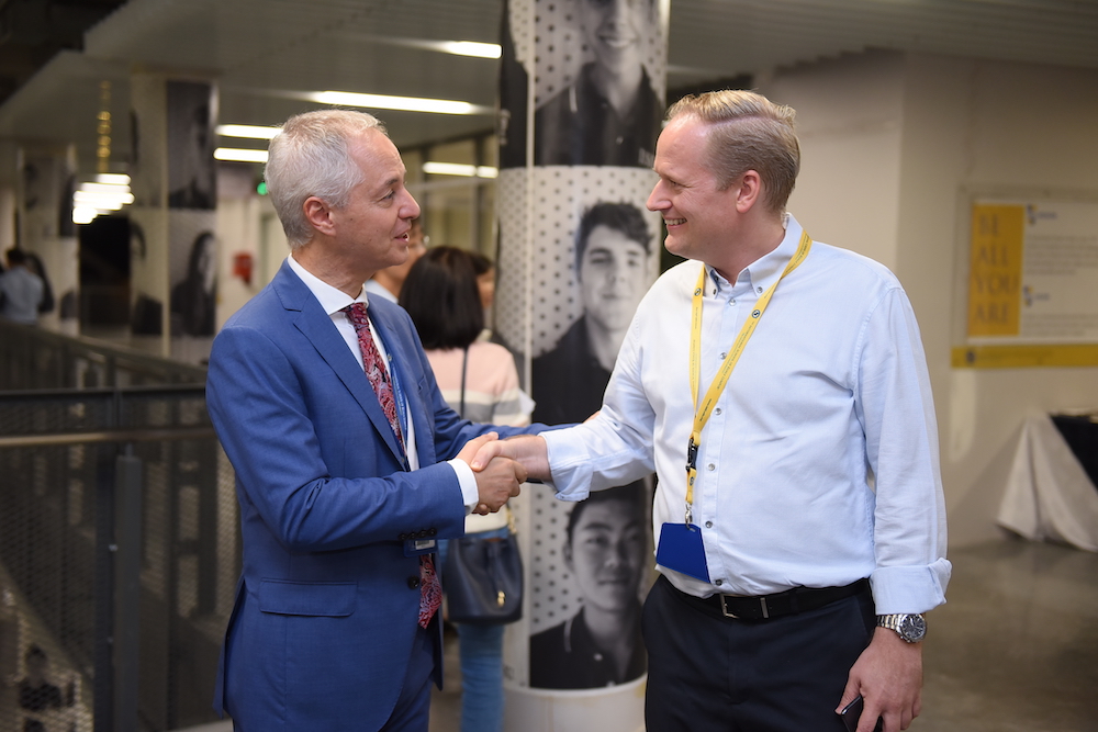 head of school greets a parent