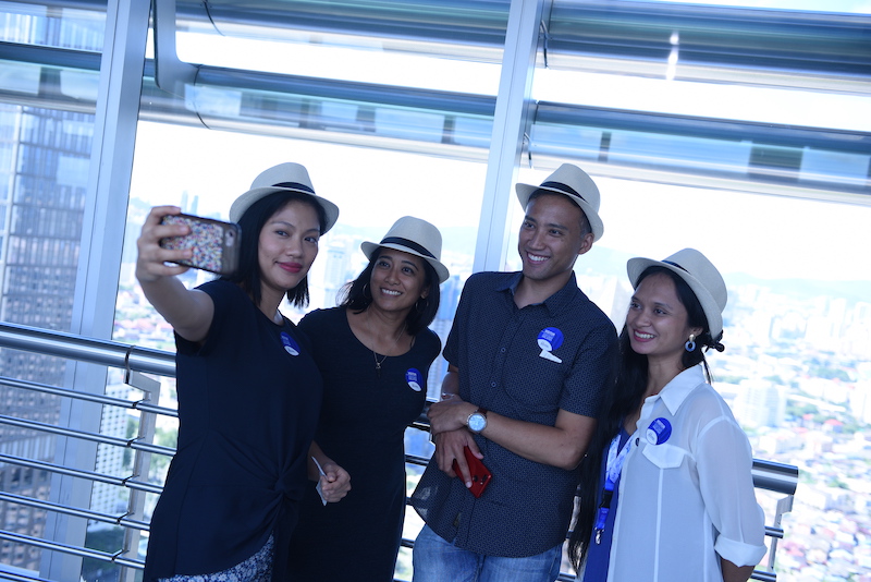 ISKL Alumni taking photos at KLCC