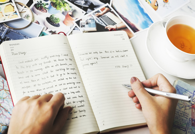 Closeup of hands writing a diary