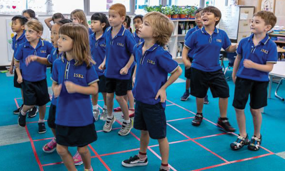 Elementary students doing fun activities in class to learn